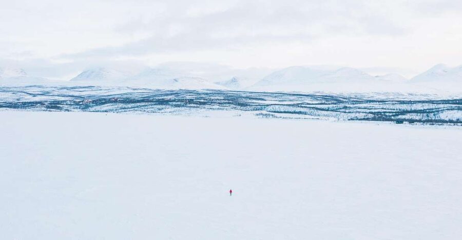 Abisko: Lake Torneträsk Arctic Ice Fishing Trip - Starting at the red-and-white building in Abisko