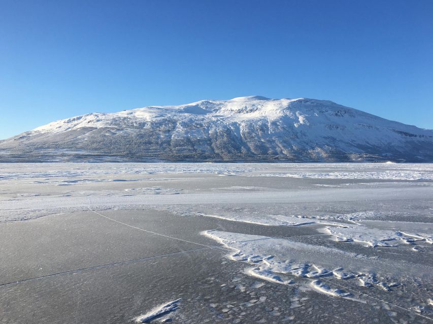 Abisko: Lake Torneträsk Arctic Ice Fishing Trip - Drilling the hole and learning the basics