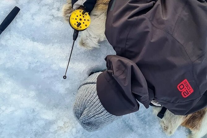 Arctic Fishing & Open Fire Cooking - Making the first hole in the ice