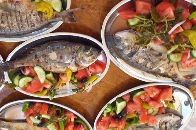 Captain Manolis Fishing with barbecue on the boat - Fresh fish, Greek salad, and beer on board