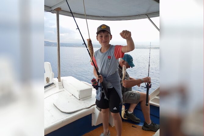 Chania Sunset Rod Fishing Experience - Homemade pie, fruit, and drinks on board