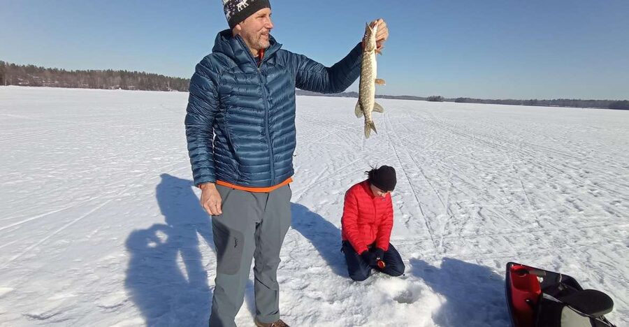 From Helsinki: Bodom Lake Ice Fishing with Food & Drinks - Makkara and glögi beside a traditional laavu