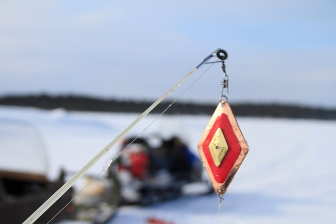 From Ivalo: Ice Fishing Safari to Lake Inari, reindeers & lunch - Lunch beside the fire is part of the appeal