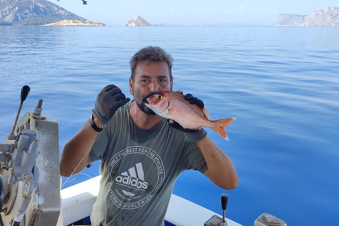Full-Day Fishing and Boating Experience in Hydra - Watching Captain Yiannis bring in the nets