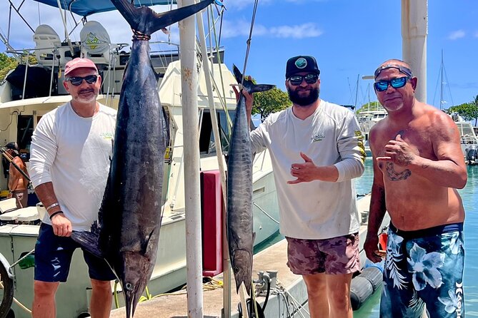 Full Day Sport Fishing Charter Honolulu - A cabin with air conditioning, a refrigerator, and a restroom