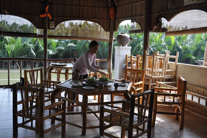 Hoi An basket boat tour with seafood lunch at fishing family - Fresh seafood served at a riverbank table