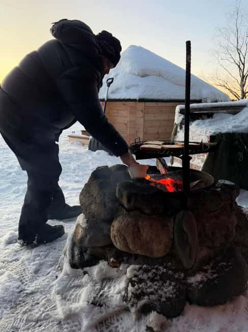 Ice Fishing Adventure in Levi with Salmon Soup - Learning to drill through the ice