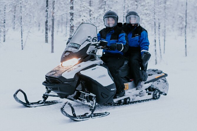 Ice Fishing by Snowmobile in Levi - Getting dressed for the snowmobile ride