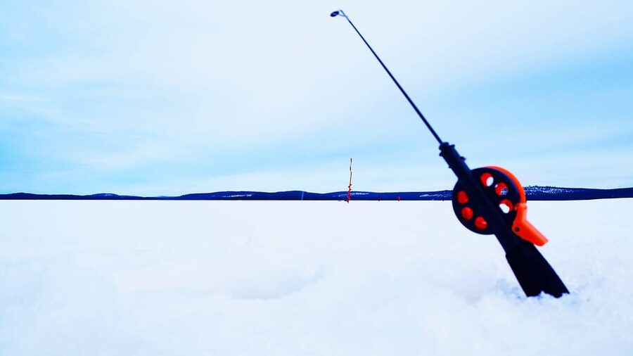 Ice fishing program in Lapland - Staying warm on the lake