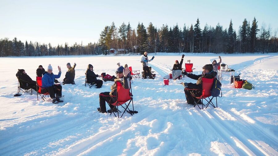 Ice fishing program in Lapland - Learning to cut through thick ice