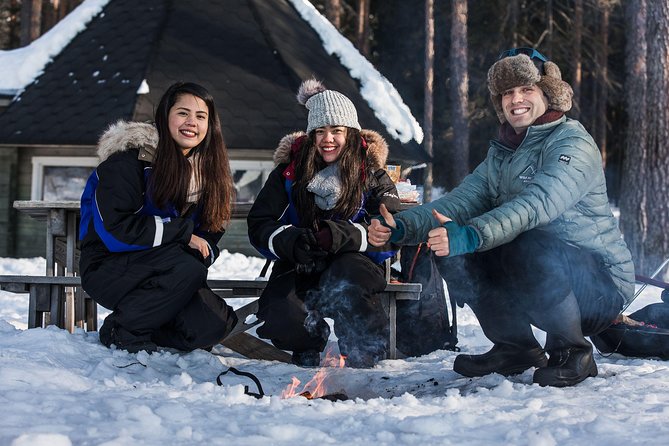 Ice Fishing Tour - Warming up beside the open fire
