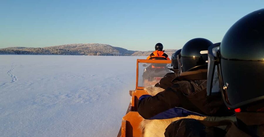 Ivalo: Ice Fishing Tour to Lake Inari, Reindeers & Lunch - A snowmobile sleigh ride across Lake Inari country