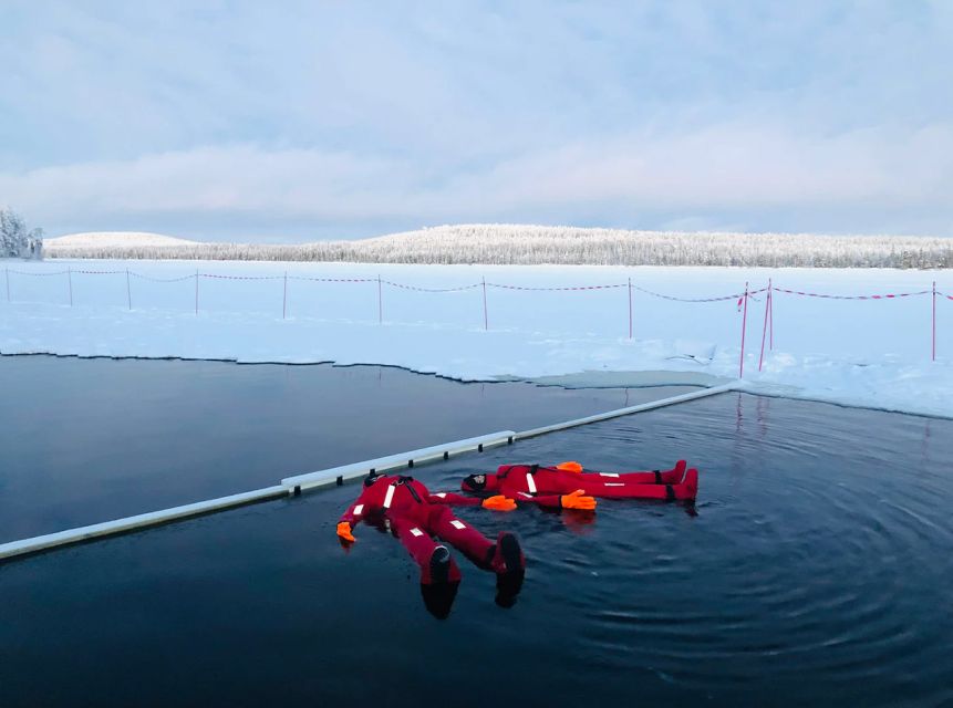 Lapland: Ice Fishing, Floating & BBQ Snow Adventure - Learning ice fishing on a frozen lake