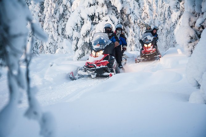 Lappish Lunch Break -Snowmobiling, ice fishing and tasty food - A quiet stop at the secret fishing hole