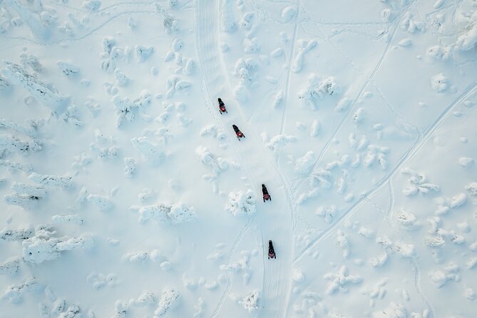 Lappish Lunch Break -Snowmobiling, ice fishing and tasty food - Getting dressed for the Arctic ride