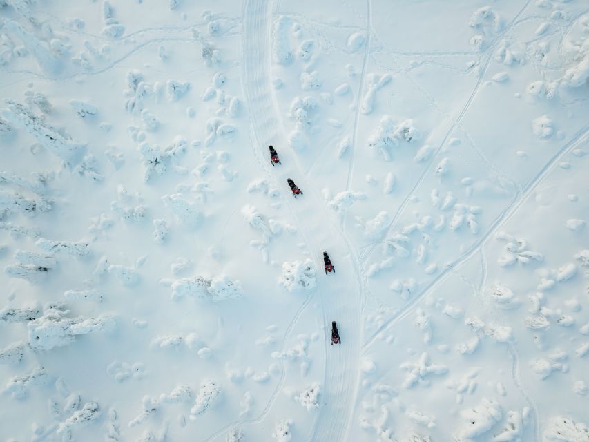 Levi: Snowmobile Safari with Ice Fishing and Outdoor Lunch - From central Levi to the frozen wilderness