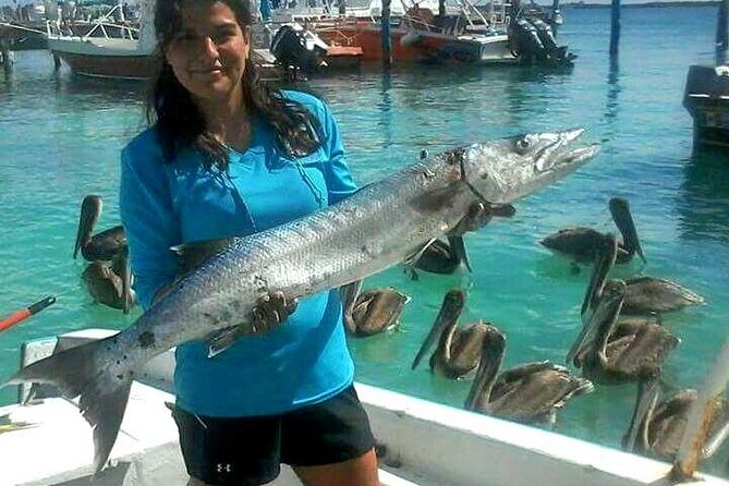 Local Fishing Plus Snorkeling Tour in Isla Mujeres - Fishing for two hours, with help from the crew
