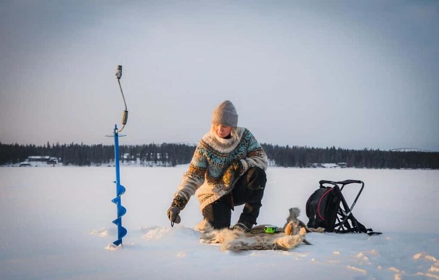 Pyhä: Ice Fishing Experience at Frozen Lake - Learning from a patient guide