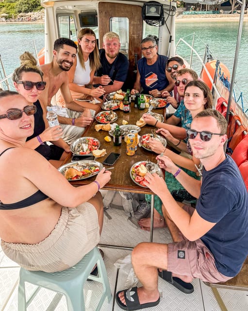 Rhodes: Captain Manolis Fishing Trip with BBQ and Swimming - Coastal views and monuments from the boat
