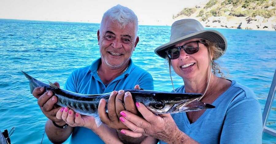Rhodes: Fishing Trip, Snorkelling, BBQ, & Professional Guide - Setting off from the Port of Kolona