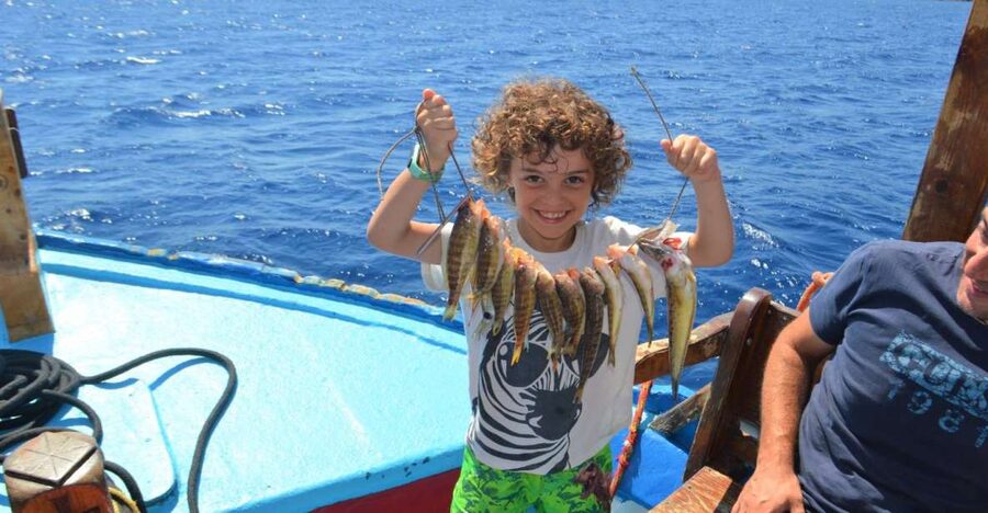 Rhodes Town: Fishing Boat Trip with Fish Meal and Swim Stops - Key points at a glance