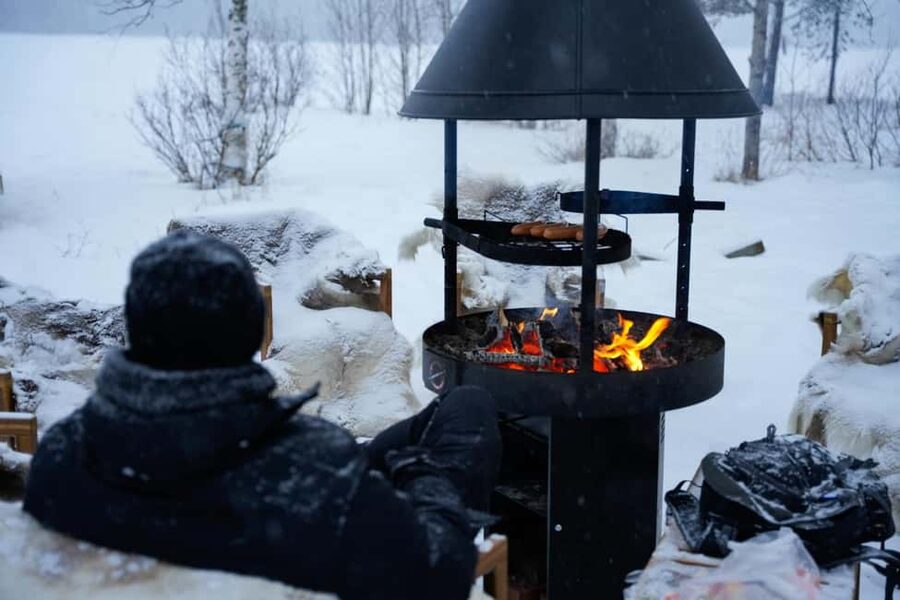 Rovaniemi: Ice Fishing from Private Lakefront Property & BBQ - Winter clothing and comfort
