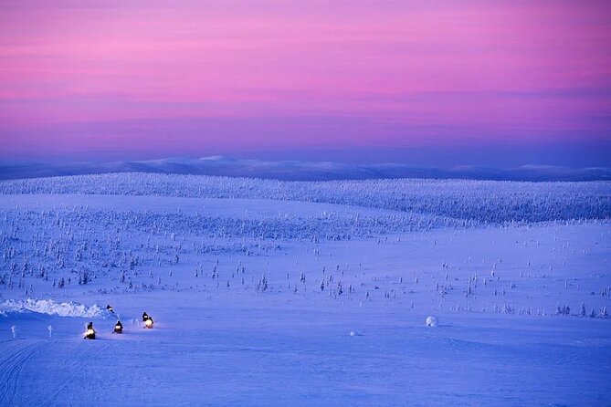 Snowmobile and Ice Fishing Experience - Snowmobiling through the Lappish forest