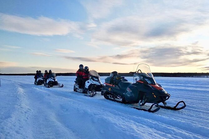 Snowmobile and Ice Fishing Experience - Drilling through nearly a meter of ice
