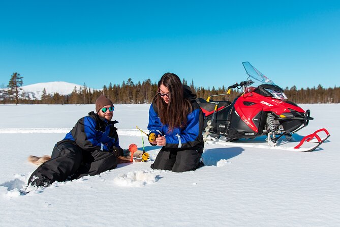 Snowmobile Safari with Ice Fishing and Outdoor Lunch in Levi - Snowmobile travel across frozen water