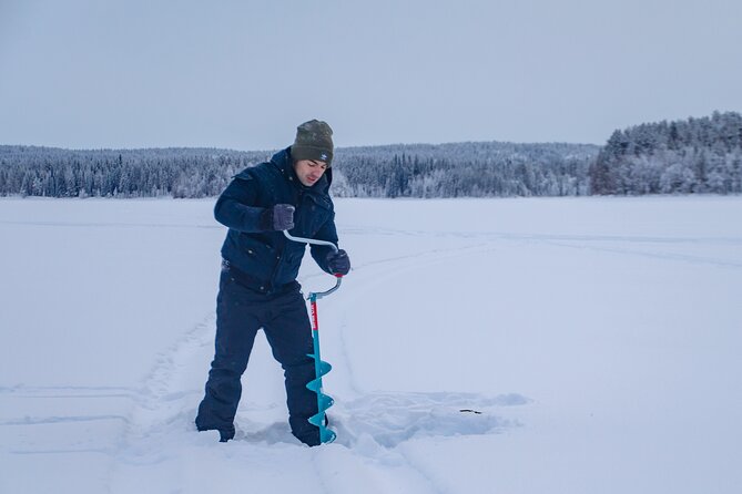 Snowshoeing Adventure with Ice-Fishing, Fire and Survival - Ice-fishing on a frozen Finnish lake