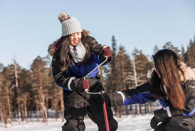 Snowshoeing and Ice Fishing Tour - Reaching the frozen lake and drilling your hole