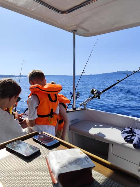 Zadar: Sunset Fishing Half-Day Guided Boat Trip - Local olive oil, bread, fish, and wine